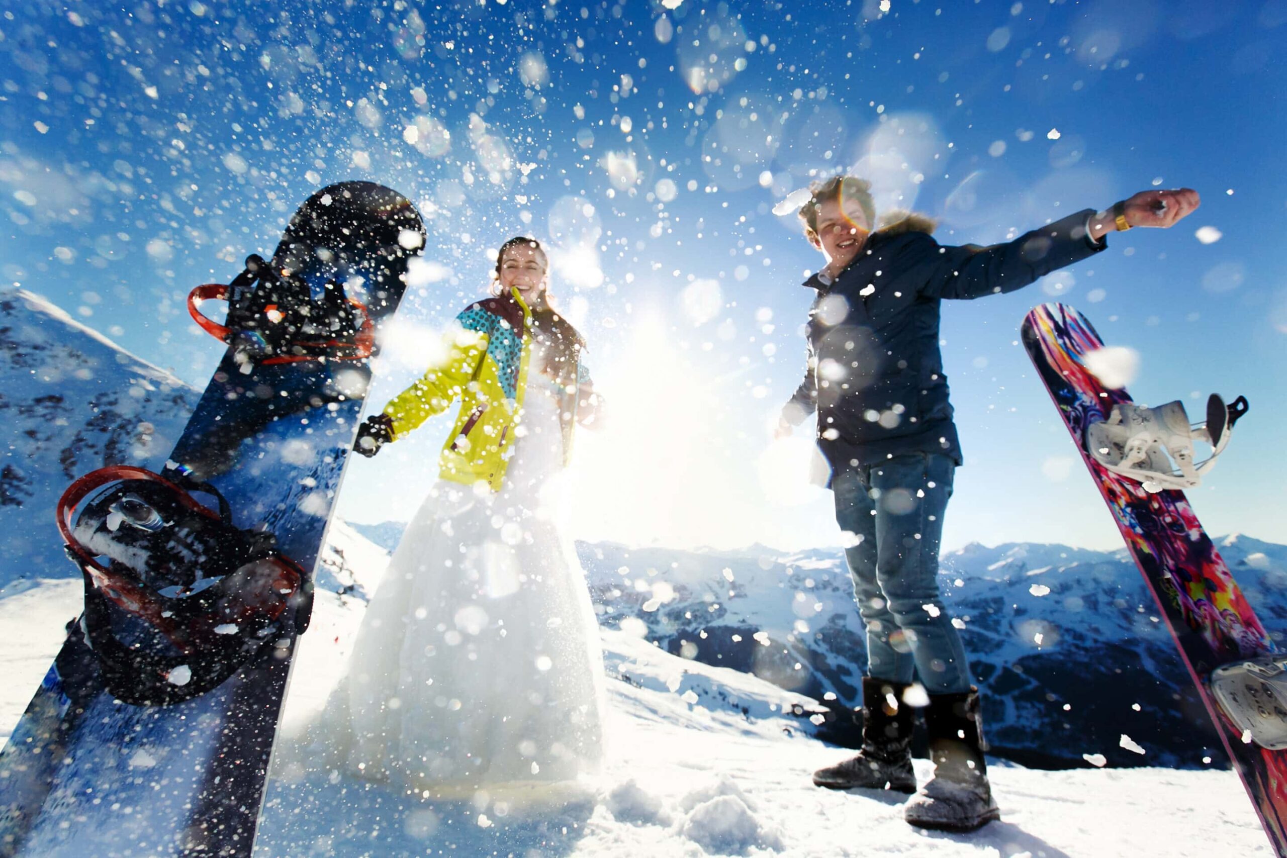 bride and groom in love throw snow background of the Alps Courch